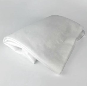 Hvilke unike egenskaper gjør nålet bomull uunnværlig i både industrielle og hjemmebruk?